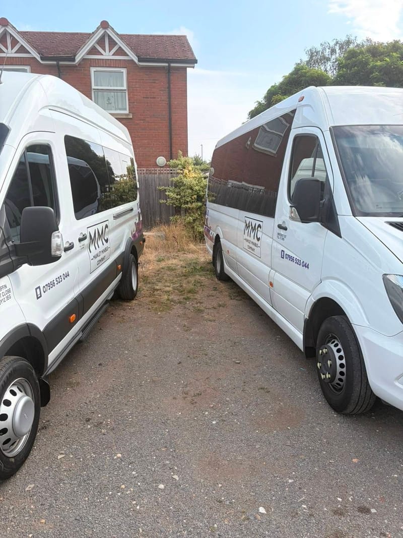 Two white Mawley Minibus Company Mercedes Sprinter minibuses side by side